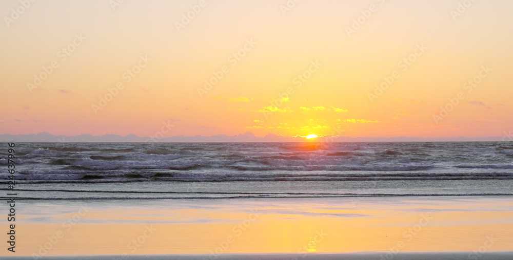 Sunset on Sandy Ocean Beach