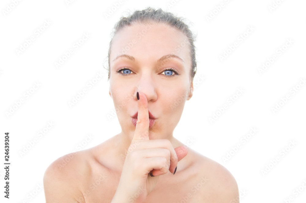 Blonde woman showing a hushing sign. Blonde woman showing a hushing sign.