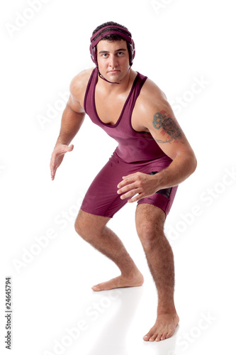 Young adult male wrestler. Studio shot over white.