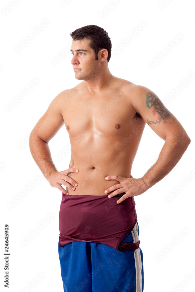 Young adult male wrestler. Studio shot over white.