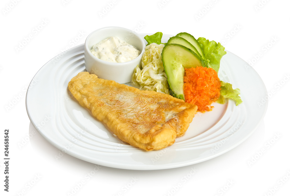 Fried fish with sauce and vegetable side dish
