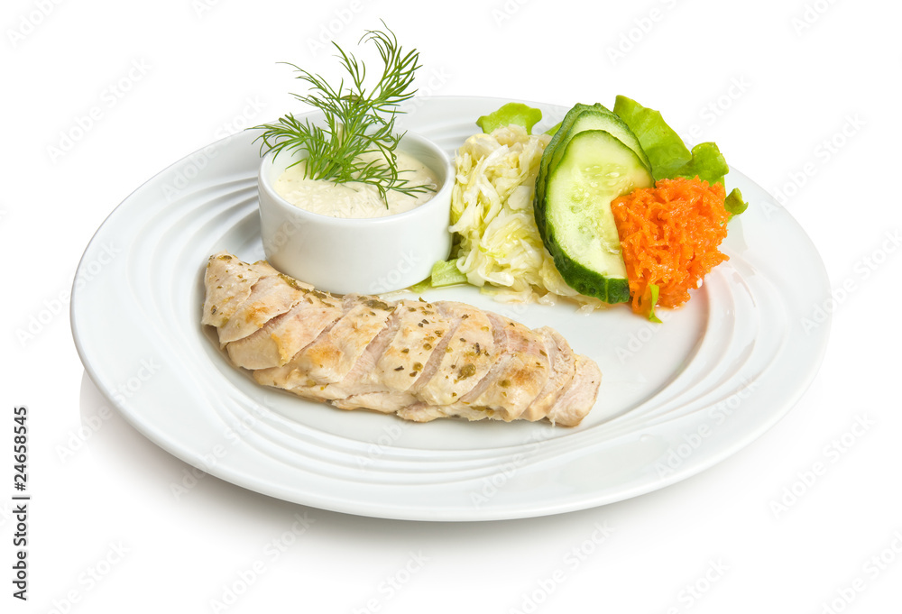 Chicken breast baked in wine with vegetable side dish.