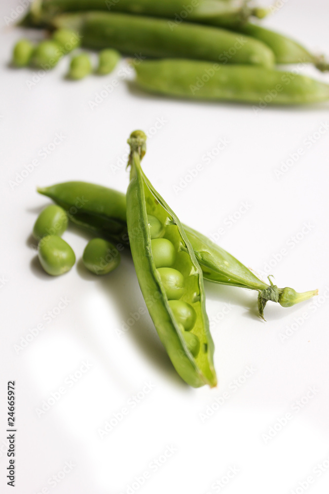 peas in a pod on a white background peas in a pod on a white background