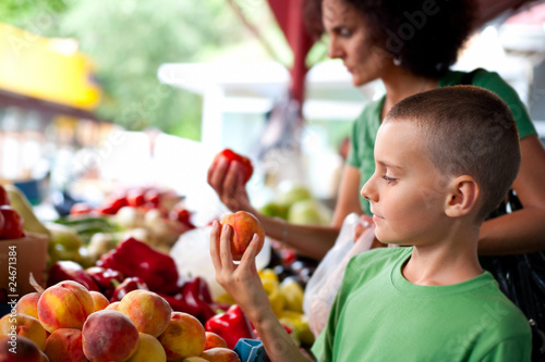 Cute boy at the farmer's market photo