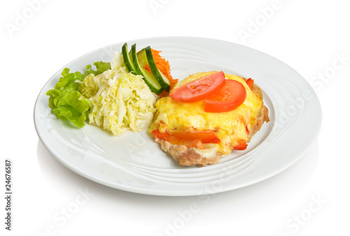 Pork chop baked with cheese and vegetables with side dish.
