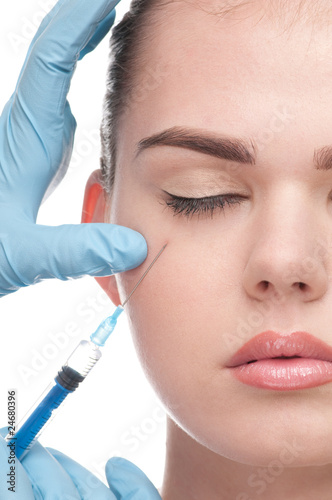 injection of botox to the face of beautiful woman