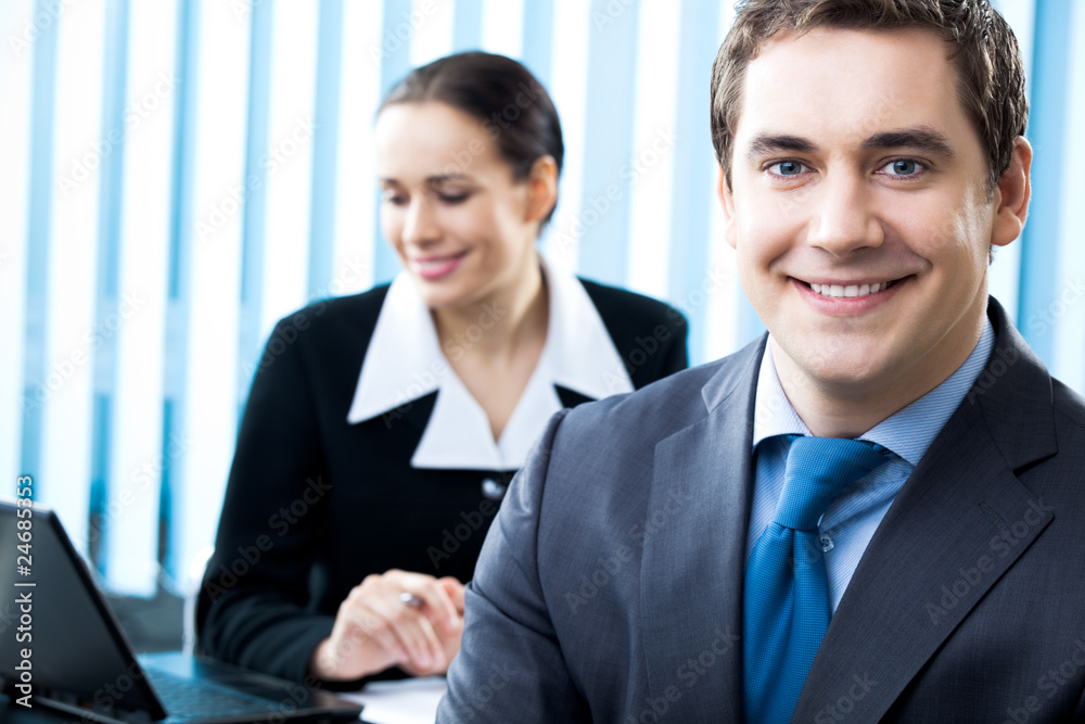 Successful businessman and colleague on background Successful businessman and colleague on background
