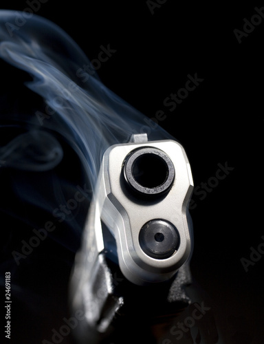 Handgun pouring out smoke