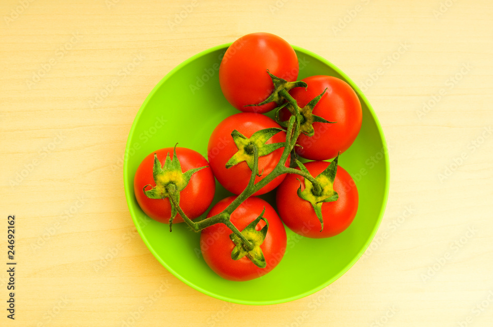 Red tomatoes isolated on the white background Red tomatoes isolated on the white background
