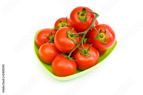 Red tomatoes isolated on the white background © Elnur