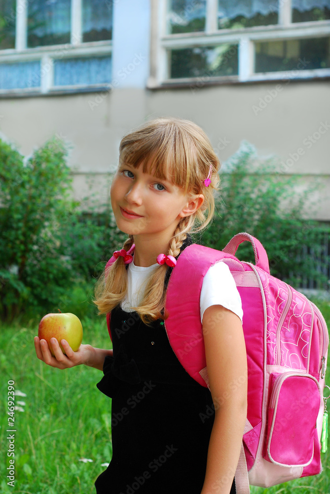 Fototapeta premium young girl going to school