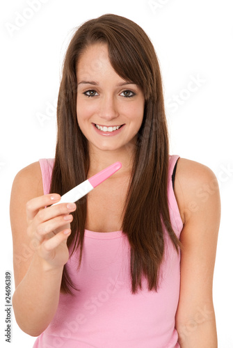 Happy teen holding pregnancy test