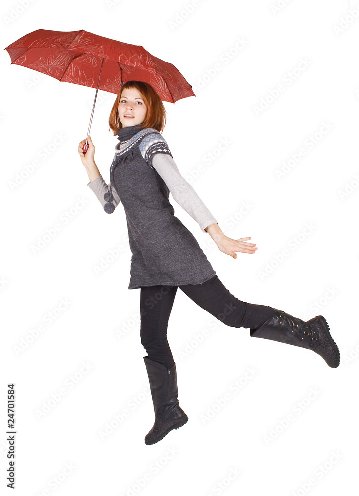 young beautiful girl in knit dress holding red umbrella and jump young beautiful girl in knit dress holding red umbrella and jump
