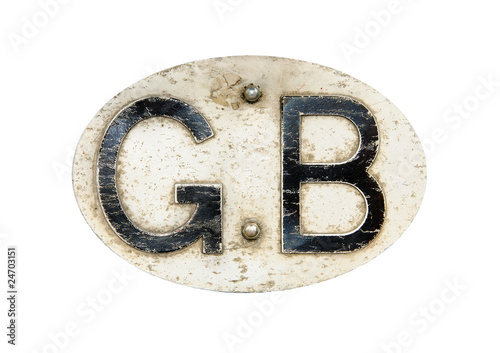 Vintage metal 'GB' (Great Britain) car grille badge, isolated on