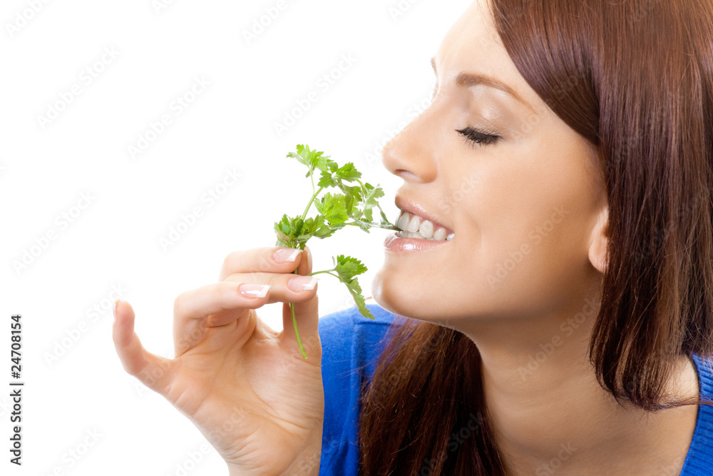 Young smiling woman with potherbs, isolated on white Young smiling woman with potherbs, isolated on white