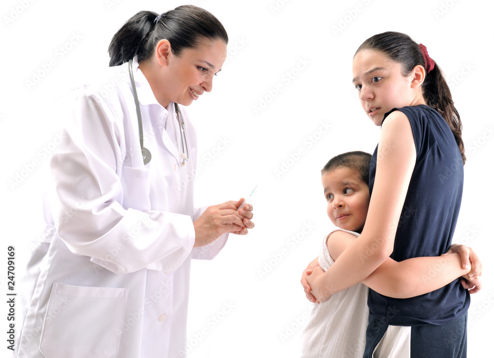 Little boy scared of injection hugging his sister. Little boy scared of injection hugging his sister.