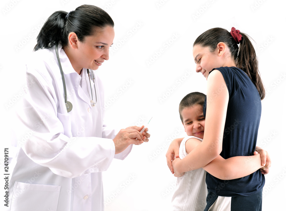 Little boy scared of injection hugging his sister. Little boy scared of injection hugging his sister.