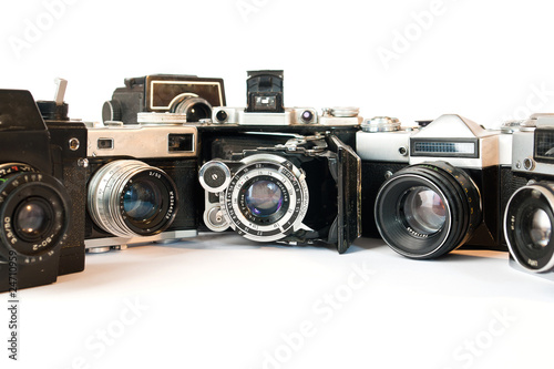 FIVE OLD CAMERAS ON A WHITE