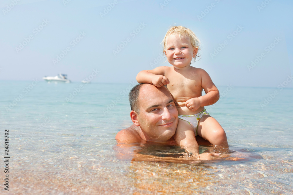 happy father and baby in water