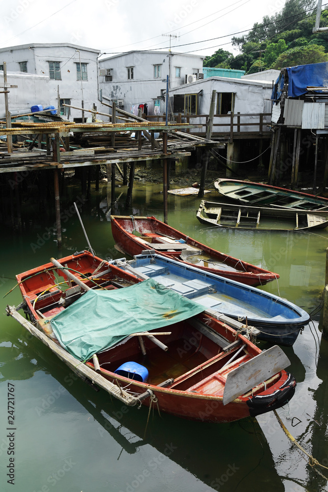 Tai O fishing village with stilt house and old boat