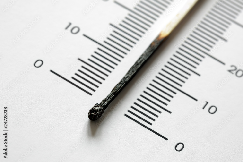 Burnt match on thermometer scale