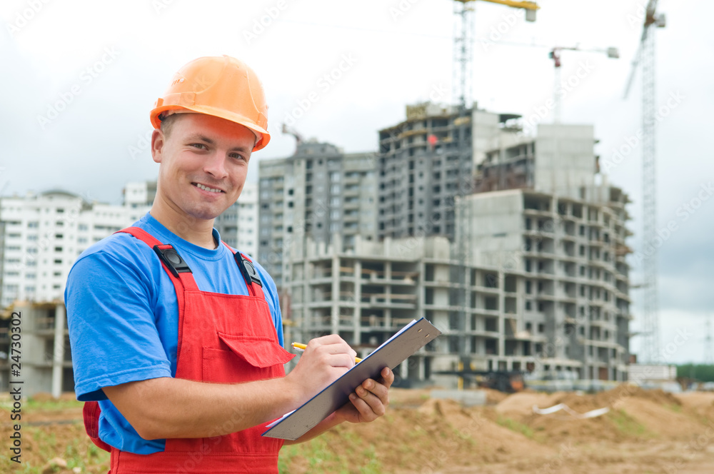 smiling Builder inspector at construction area smiling Builder inspector at construction area