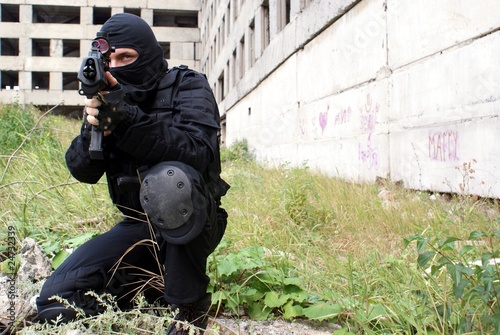 Special division. The man. The weapon. A military uniform.