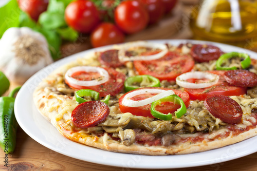 Pizza with chorizo salami and mushrooms
