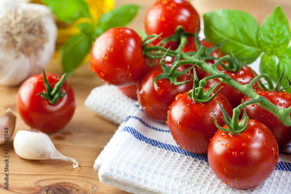 Fresh cherry tomatoes on the vine Fresh cherry tomatoes on the vine