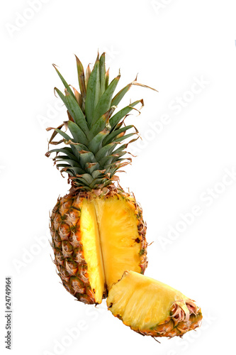 Golden pineapple with one slice open