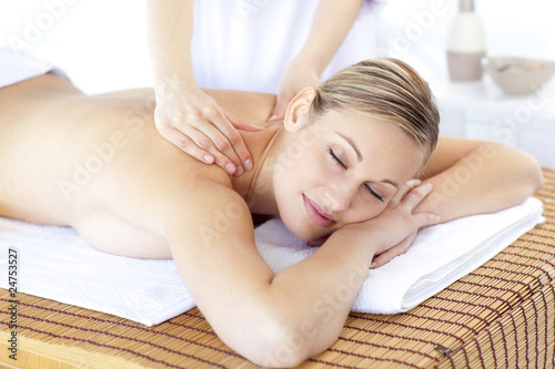 Positive woman having a back massage
