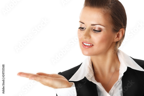 smiling modern business woman presenting something on empty hand