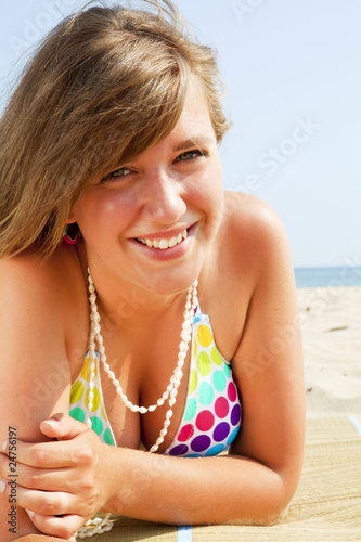 smiling young woman on the beach