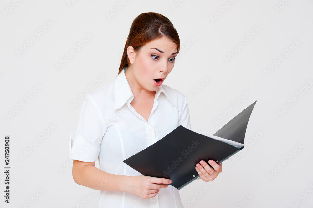 amazed woman looking in her report amazed woman looking in her report