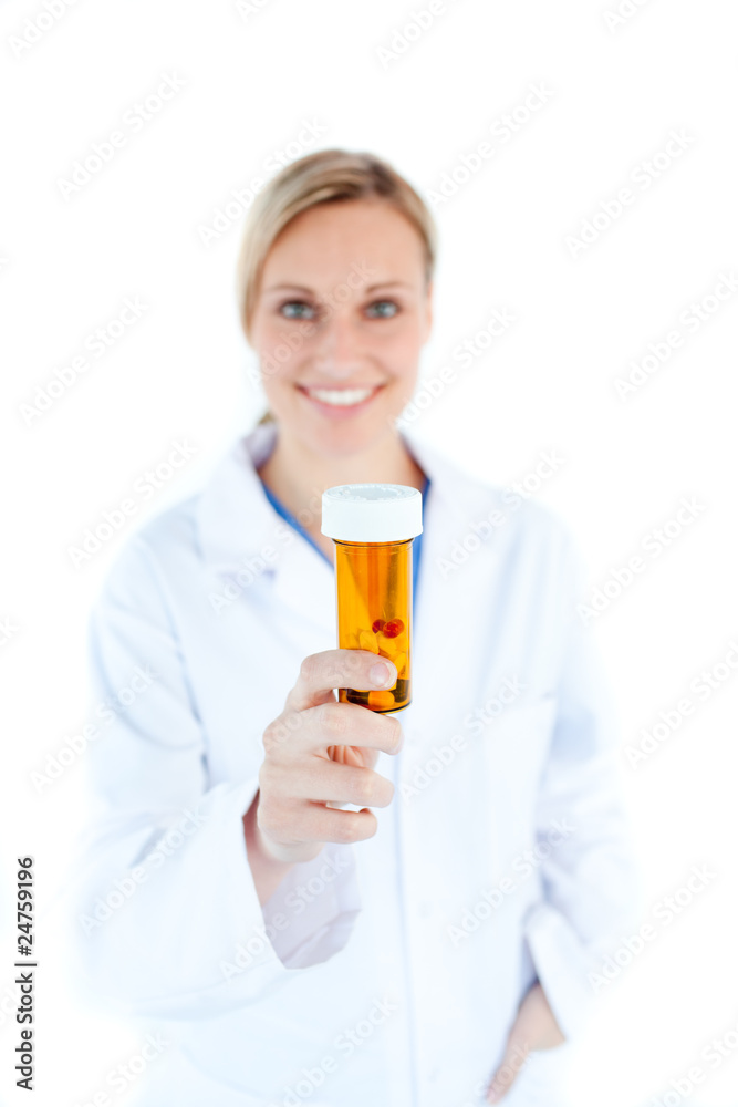 Portrait of caucasian doctor holding pills in the camera