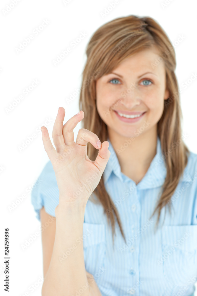 Successful young businesswoman showing OK sign Successful young businesswoman showing OK sign