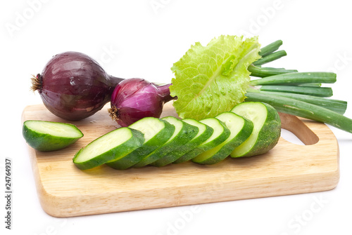Green cucumber slices with red onion