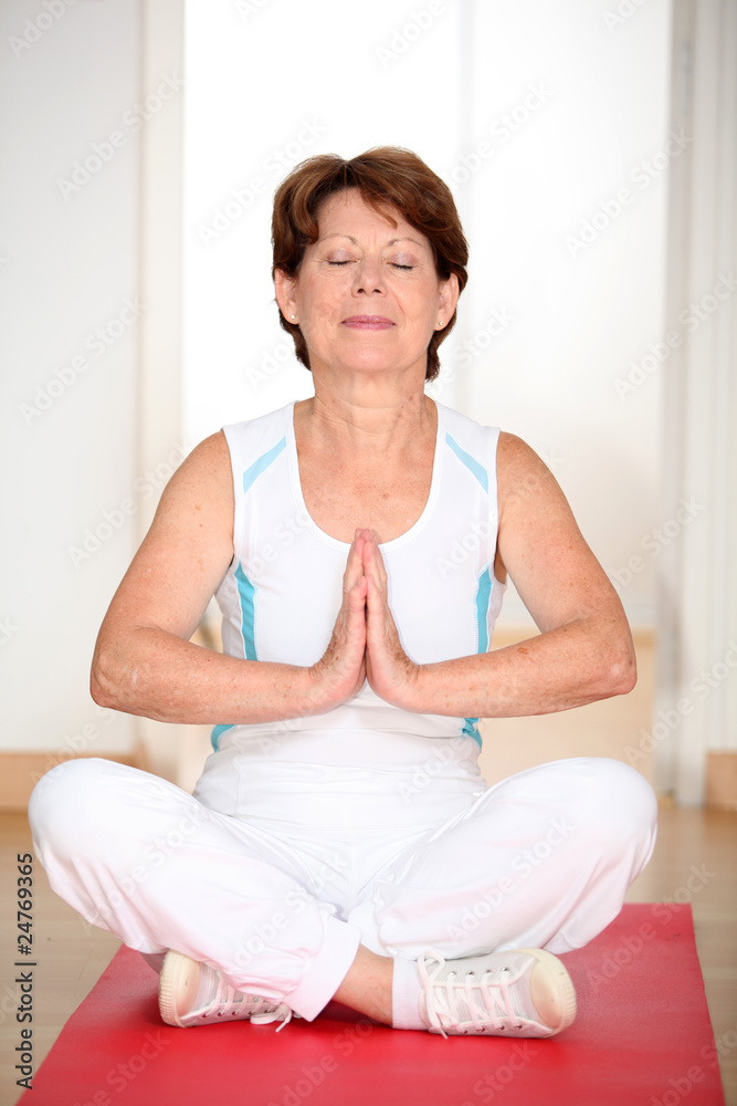 Closeup of senior woman doing yoga Closeup of senior woman doing yoga