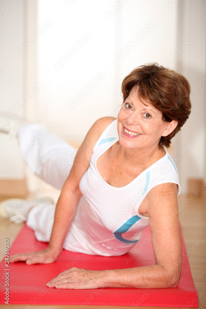 Closeup of senior woman doing stretching exercises Closeup of senior woman doing stretching exercises