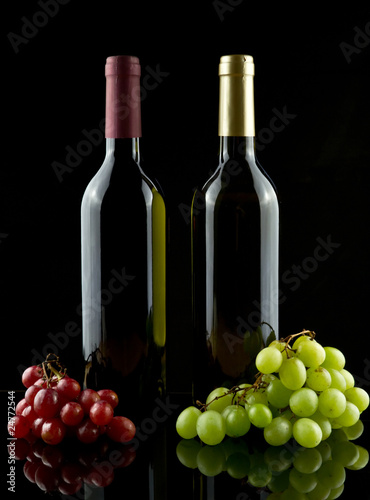 Red and white wine and grapes