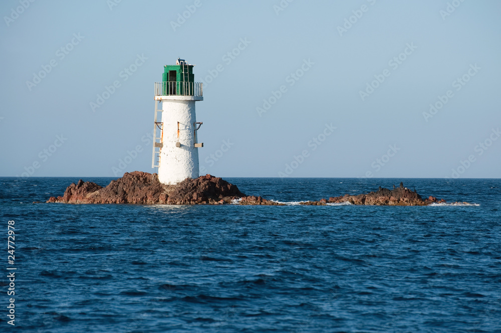 Obraz premium Pecorella lighthouse located on a rock, Corsica