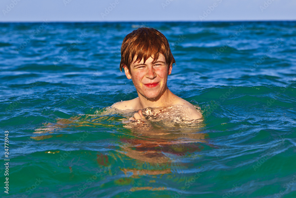 young boy enjoys the sea