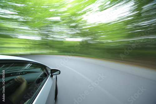 car driving fast into forest © MP_P