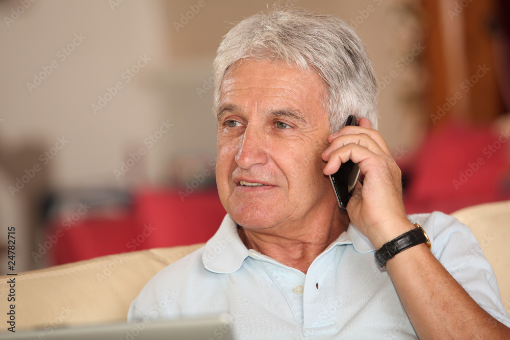 Closeup of senior man talking on mobile phone Closeup of senior man talking on mobile phone