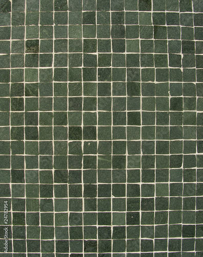 dark green tiles mosaic pattern on a wall