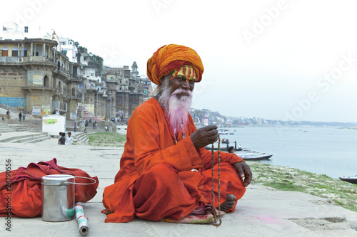 Old Sadhu at the ghats in Varanasi, India. photo