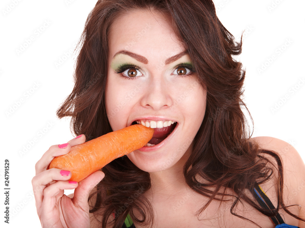 Face of girl eating carrot.