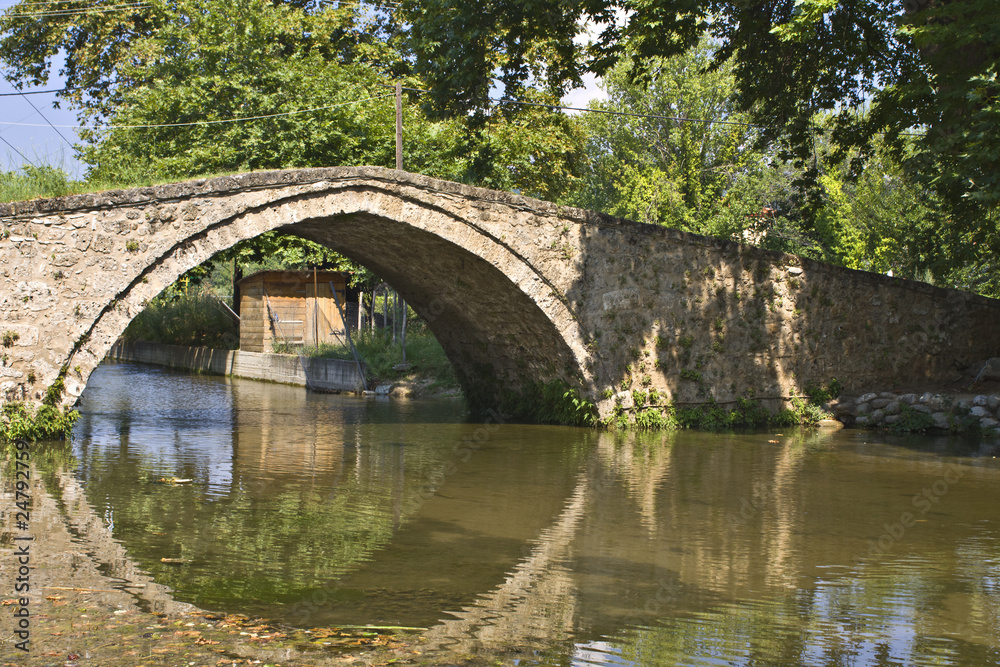 Fototapeta premium Old stone footbridge at Edessa city in Greece