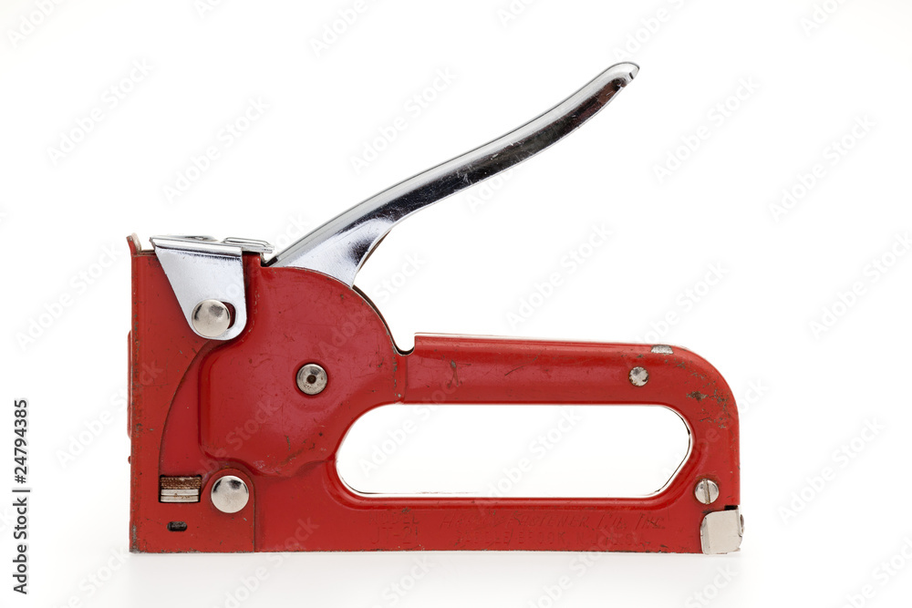 A red stapler isolated on a white background A red stapler isolated on a white background