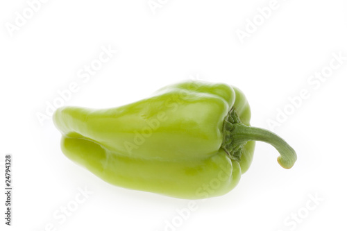 A fresh green pepper isolated on a white background